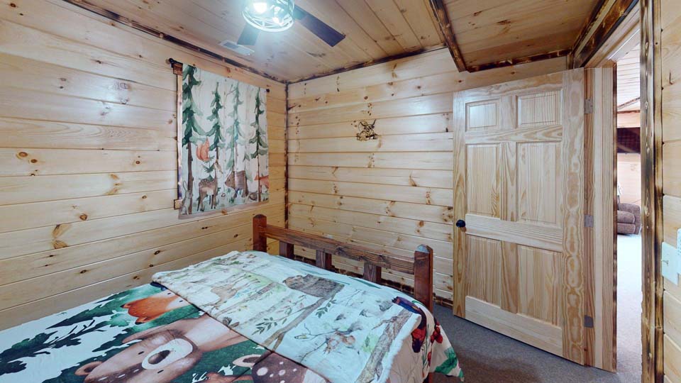 willifeesp-mar26-35 Spacious back deck featuring a stone wood-burning fireplace.